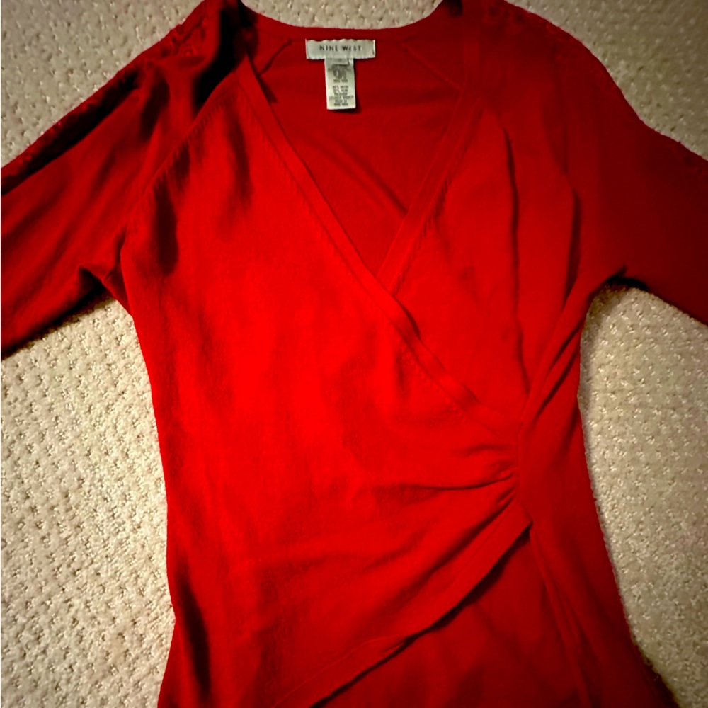Women’s faux wrap, red sweater, lace sleeve details. Great condition.